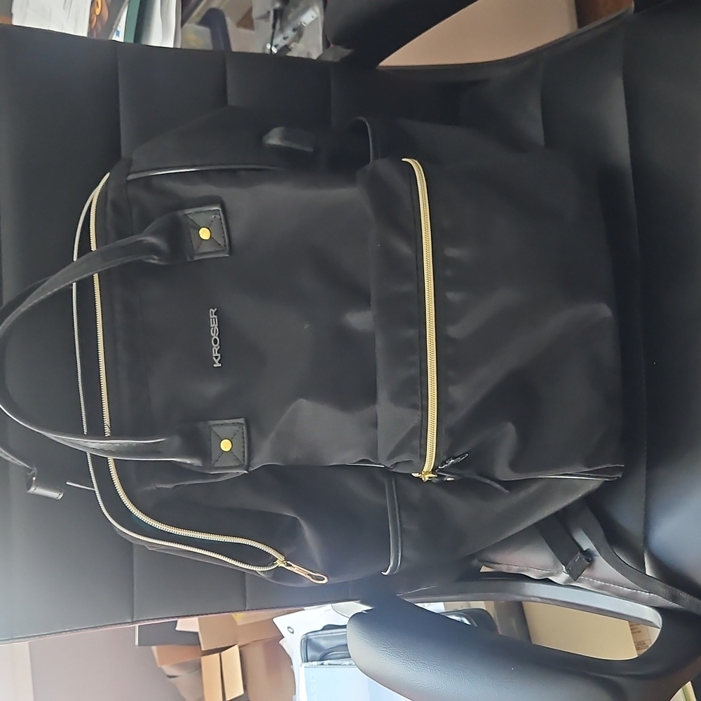 Black Kroser backpack with gold zippers
